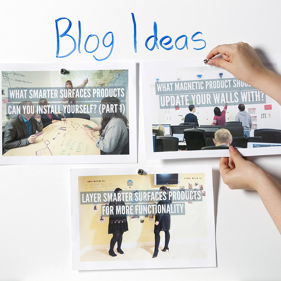 Magnets holding paper on magnetic whiteboard wallpaper